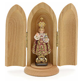 Infant of Prague wooden statue painted in niche