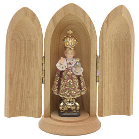 Infant of Prague wooden statue painted in niche