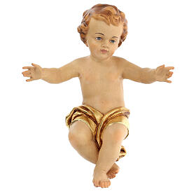 Baby Jesus wooden figurine with opened arms and golden drape