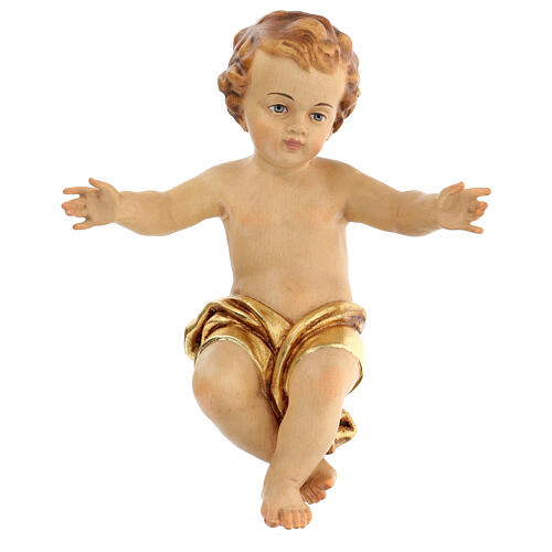 Figura Niño Jesús a brazos abiertos madera con paño dorado. 1