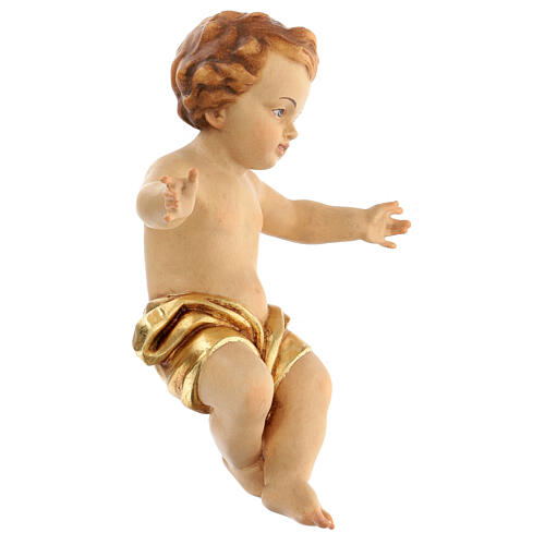 Figura Niño Jesús a brazos abiertos madera con paño dorado. 3