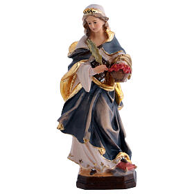 Santa Dorotea de madera pintada con vestido azul y flores rojas