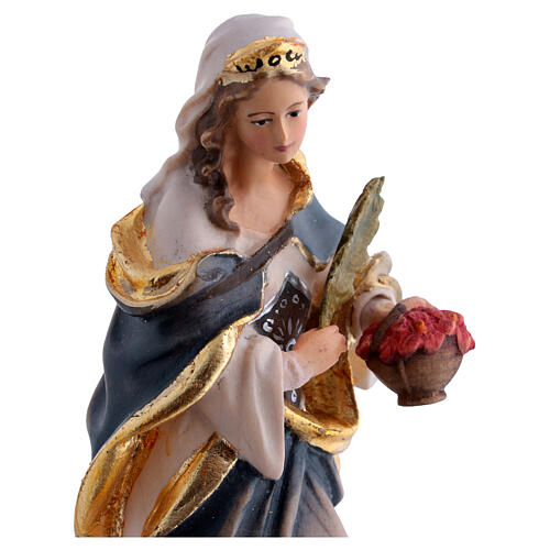 Santa Dorotea de madera pintada con vestido azul y flores rojas 2