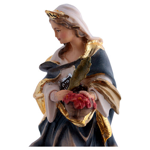 Santa Dorotea de madera pintada con vestido azul y flores rojas 4