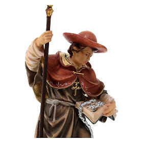 Wooden coloured statue of Saint Leonard Valgardena