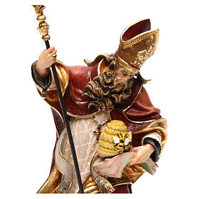 Saint Ambrose with beehive in coloured wood of Valgardena