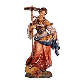 Painted statue in wood Saint Notburga, Val Gardena