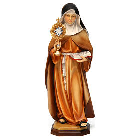Statue of St. Claire of Assisi with monstrance in painted wood from Val Gardena