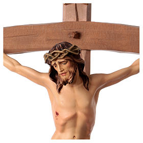 Crucifix in wood, curved cross and blue garment, Val Gardena