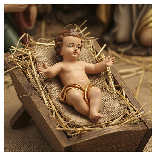 Baby Jesus in fiberglass with open arms and golden drape 2