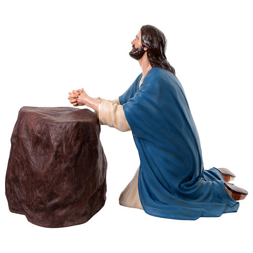 Jesus in prayer with rock in Gethsemane, painted fibreglass 1