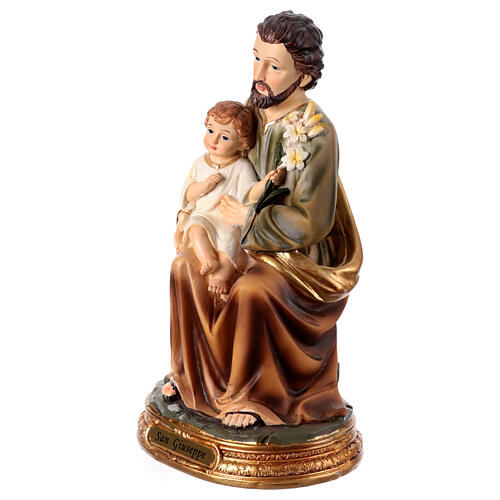 St Joseph sitting with Jesus Child, painted resin statue of 8 in 3