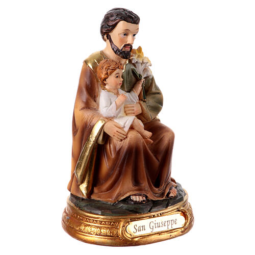 Statue of St Joseph sitting with Jesus Child, painted resin, 4 in 3