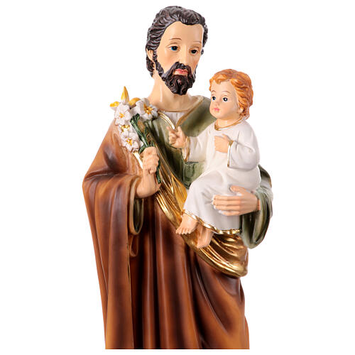 St Joseph with Infant Jesus and lily, painted resin statue of 12 in 2