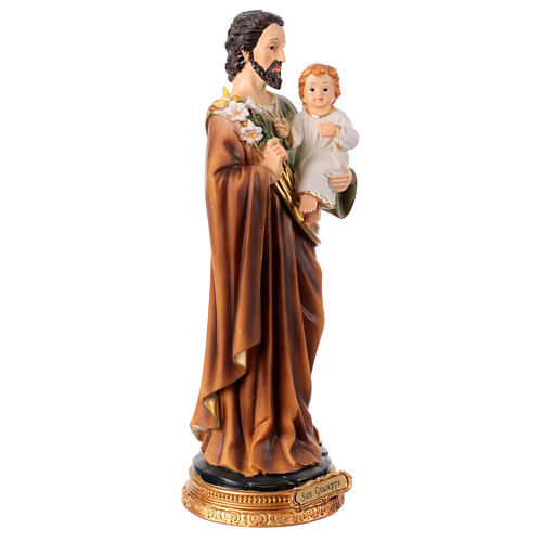 St Joseph with Infant Jesus and lily, painted resin statue of 12 in 4