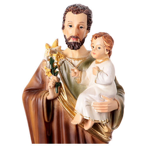 St Joseph with lily and Infant Jesus, painted resin, 10 in 2