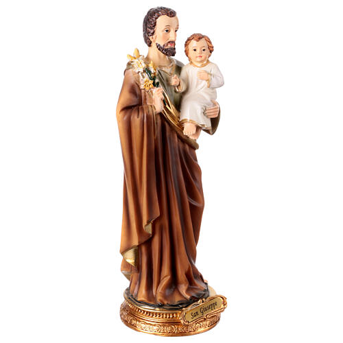 St Joseph with lily and Infant Jesus, painted resin, 10 in 4