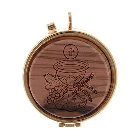 Holy bread pyx in metal with a Chalice image, in a wooden carved disk 5,5 cm diameter