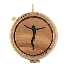 Custodes à hosties: Custode à hostie plaque olivier Crucifix stylisé diam. 6 cm Custodes à hosties: Custode à hostie plaque olivier Crucifix stylisé diam. 6 cm