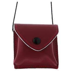 Red leather bag with black button and fabric string for mass kit