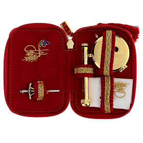 Red brocade case for Holy Communion travel kit