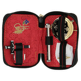 Black leather case with red lining and Holy Communion travel kit
